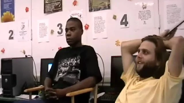 Tracy Morgan and Micah Perta seated in a classroom